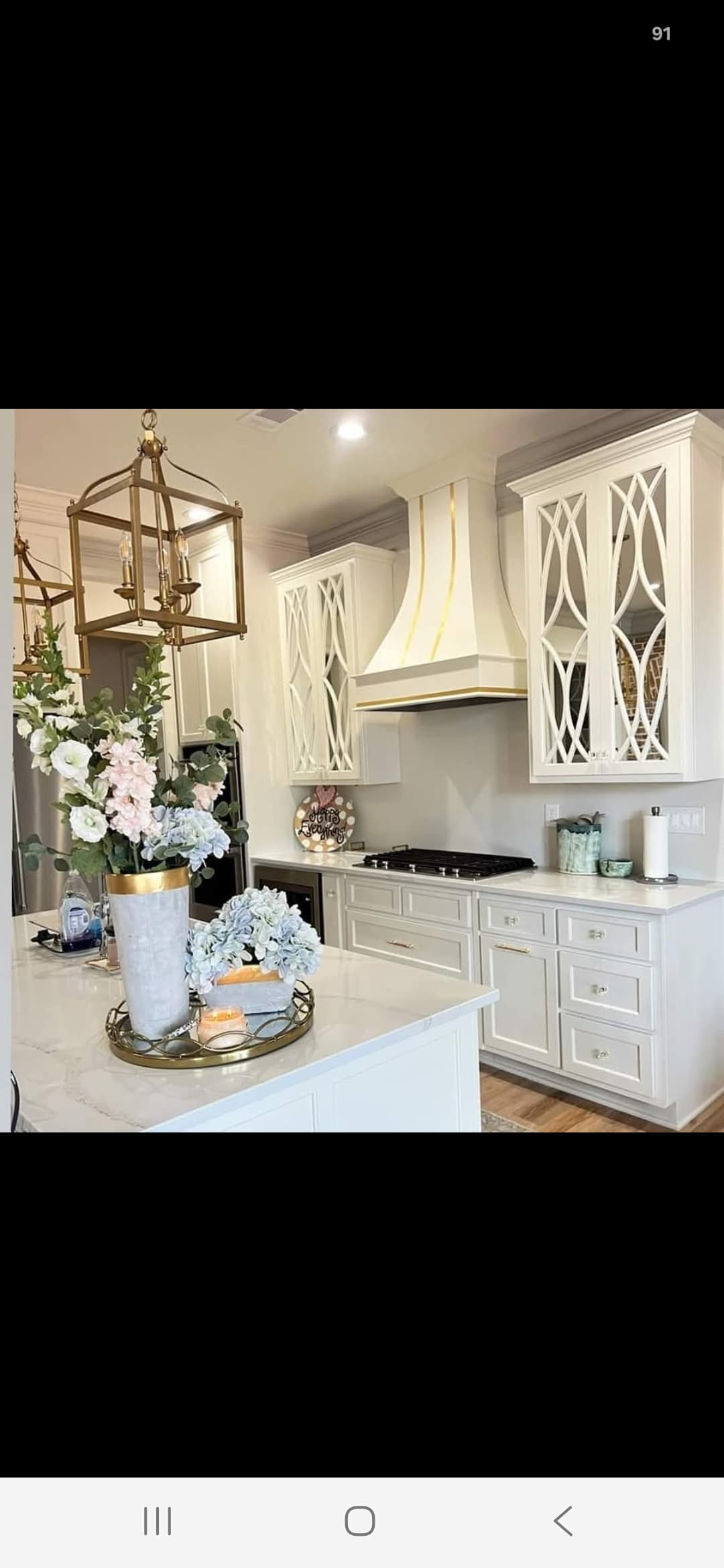 White kitchen with quartz island countertop